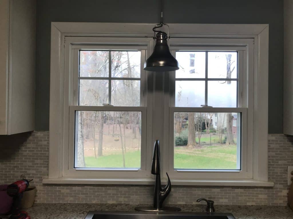 Interior view of new SoftLite double hung windows behind a kitchen sink
