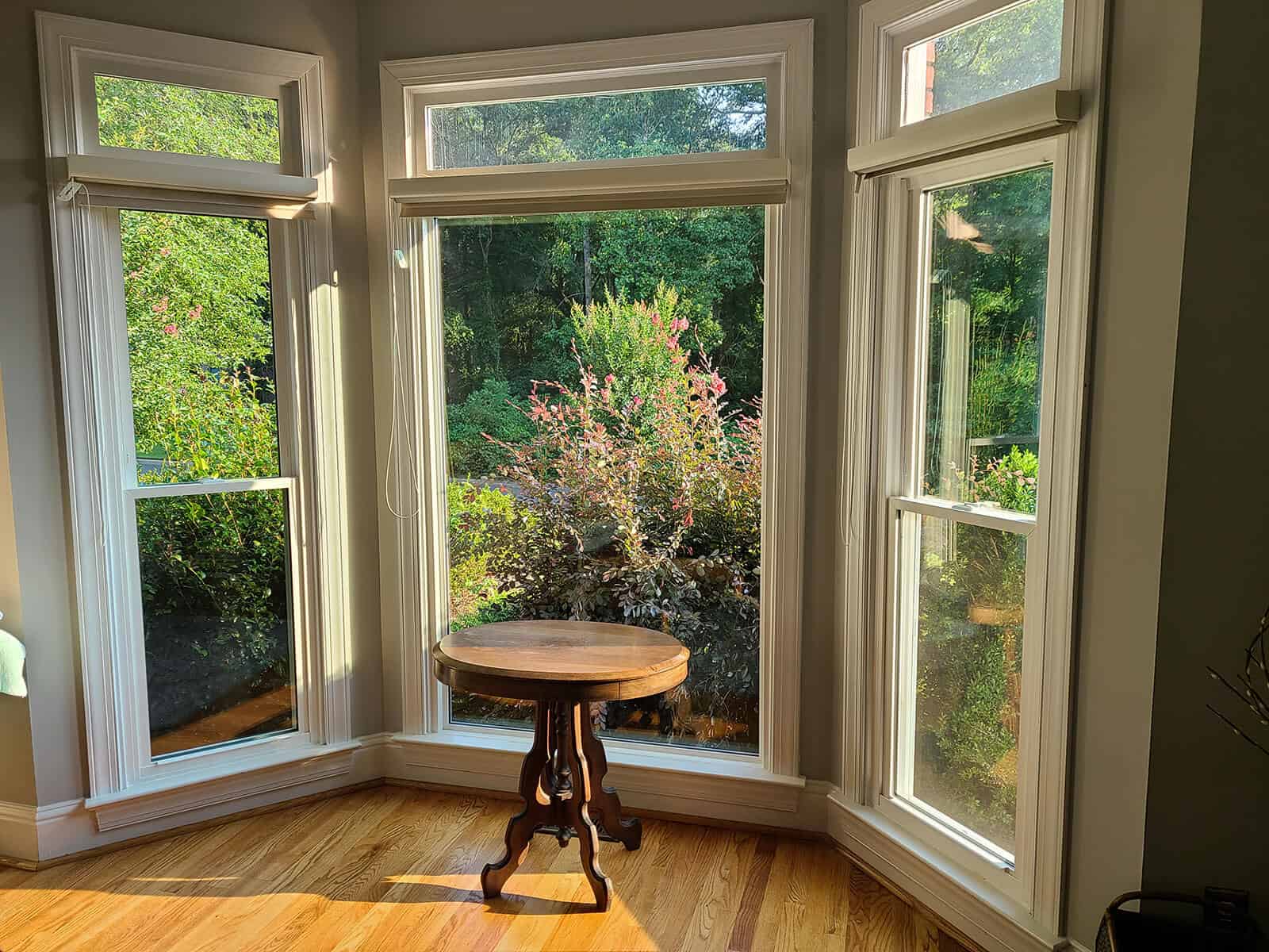 Interior view of two double hung windows installed on either side of a picture window