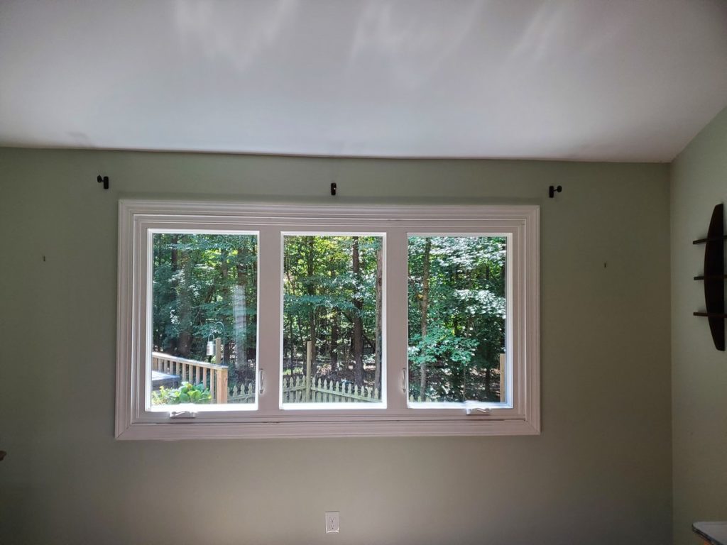 three casement windows with view of trees