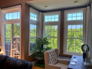 large windows in a living room.