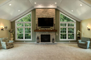 Interior view of a living room with large SoftLite windows on their side of a fireplace