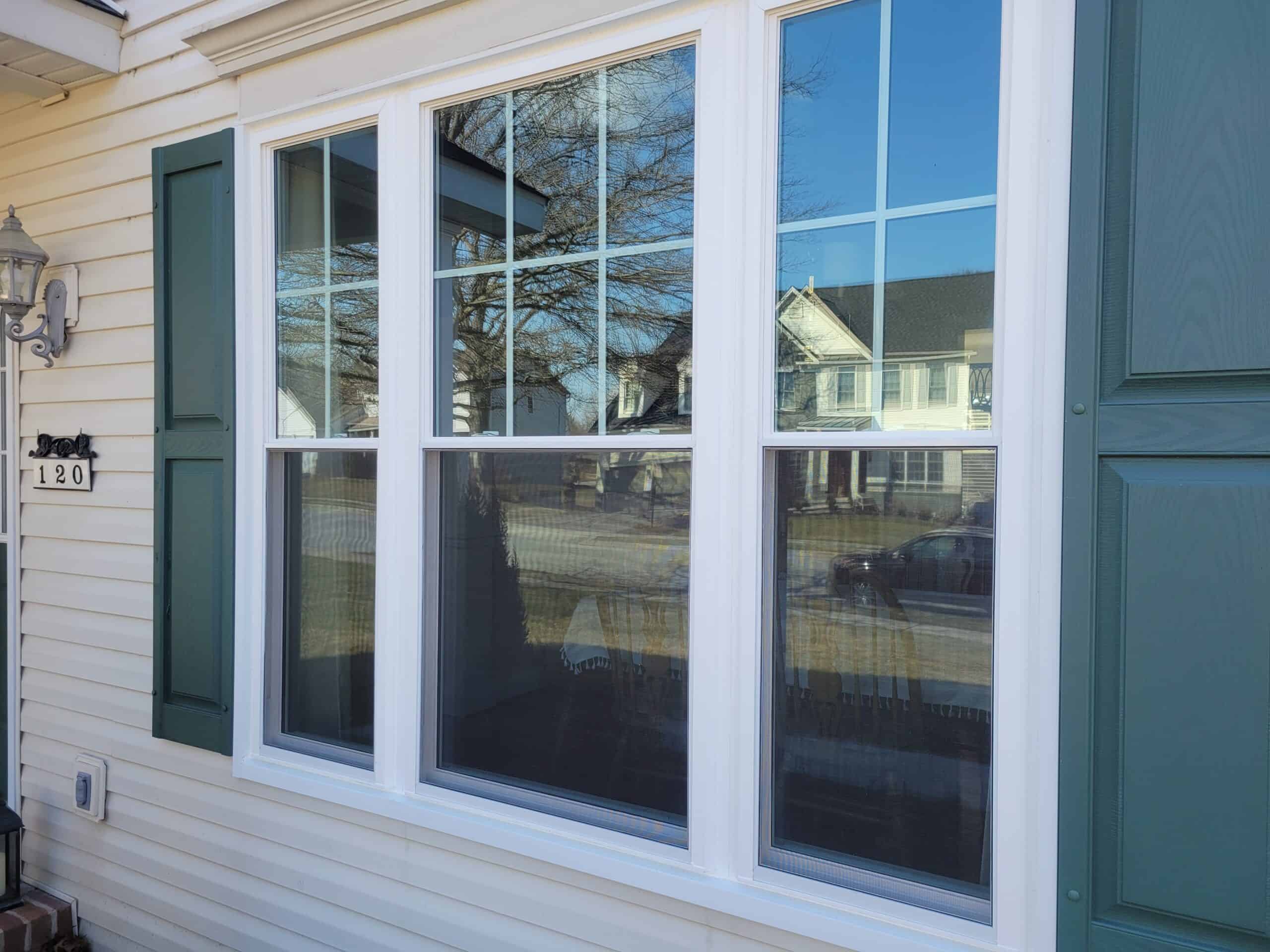 Exterior view of SoftLite replacement windows installed in a home