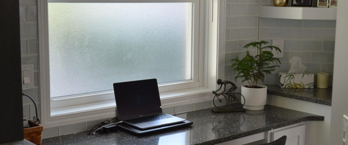 frosted window at a desk to provide privacy